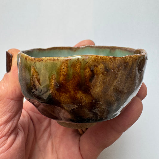 Brown cup with green inside