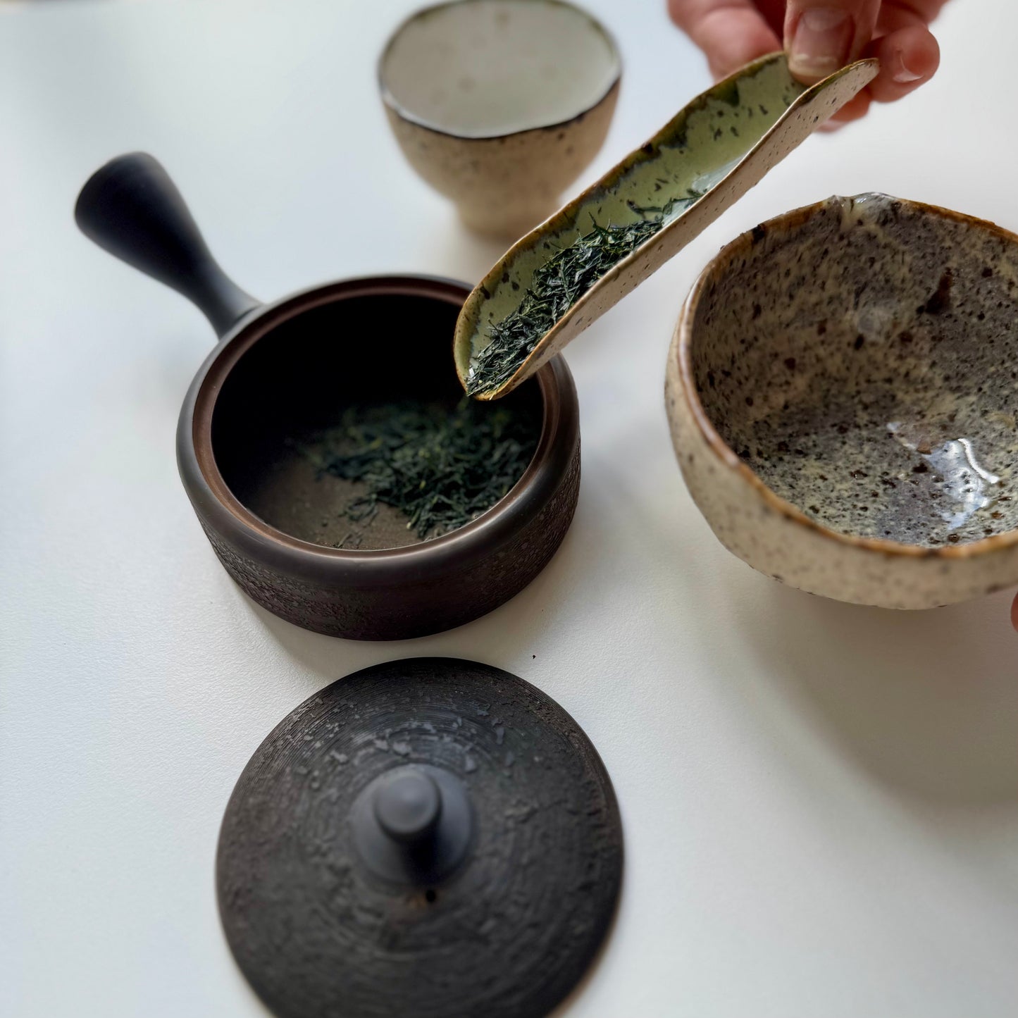 Larger gray scoop with brown rim