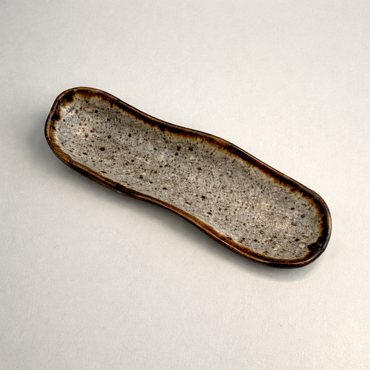 Larger gray scoop with brown rim